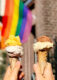 Two gelatos in cone with pride flag in the background
